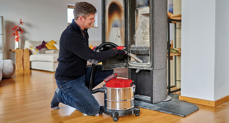 man using ash vacuum cleaner 